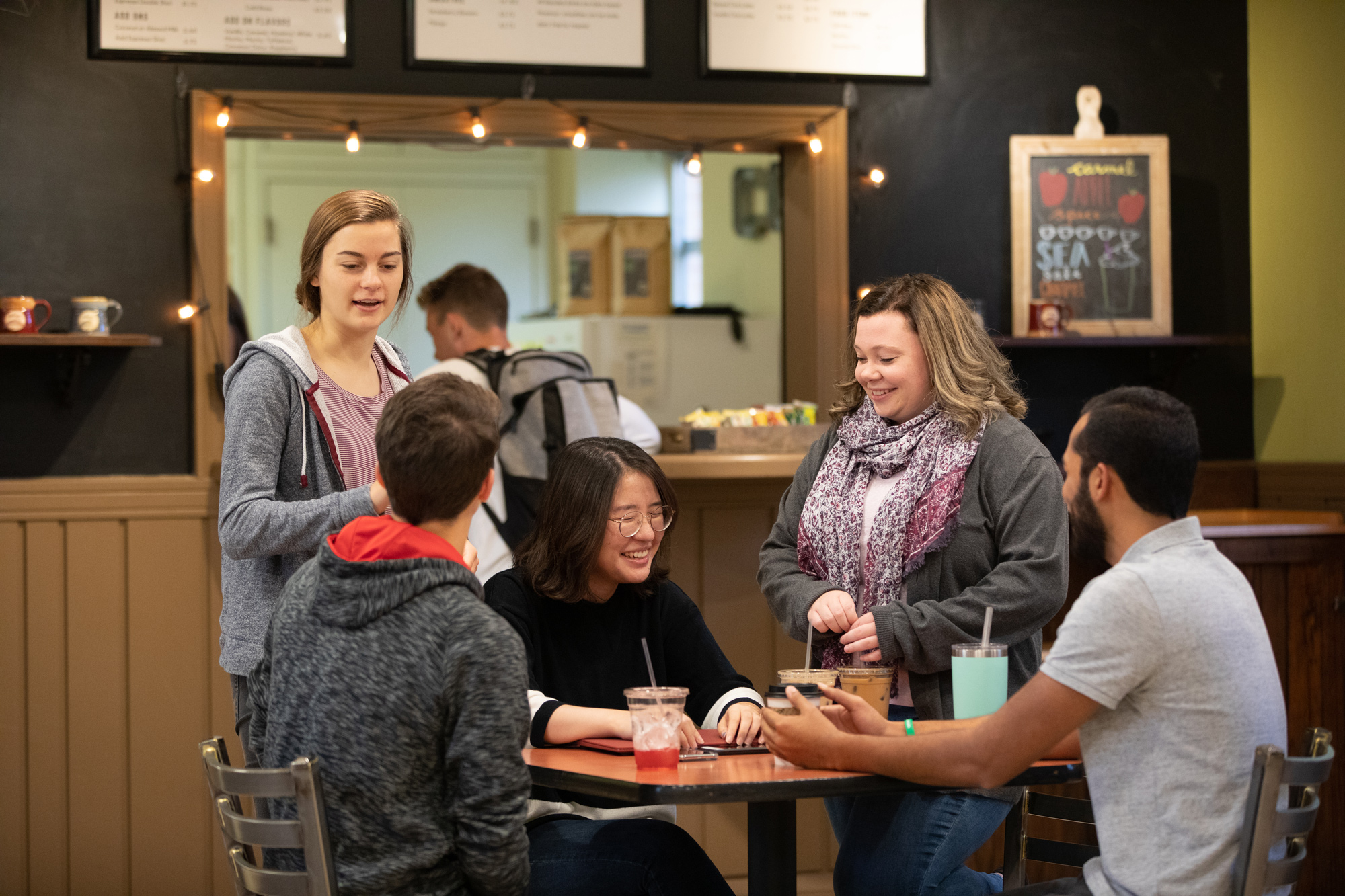 Emmaus students hanging out in campus coffee shop