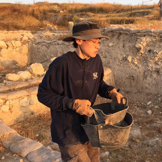 Emmaus alum, Sam George, on an archaeological dig