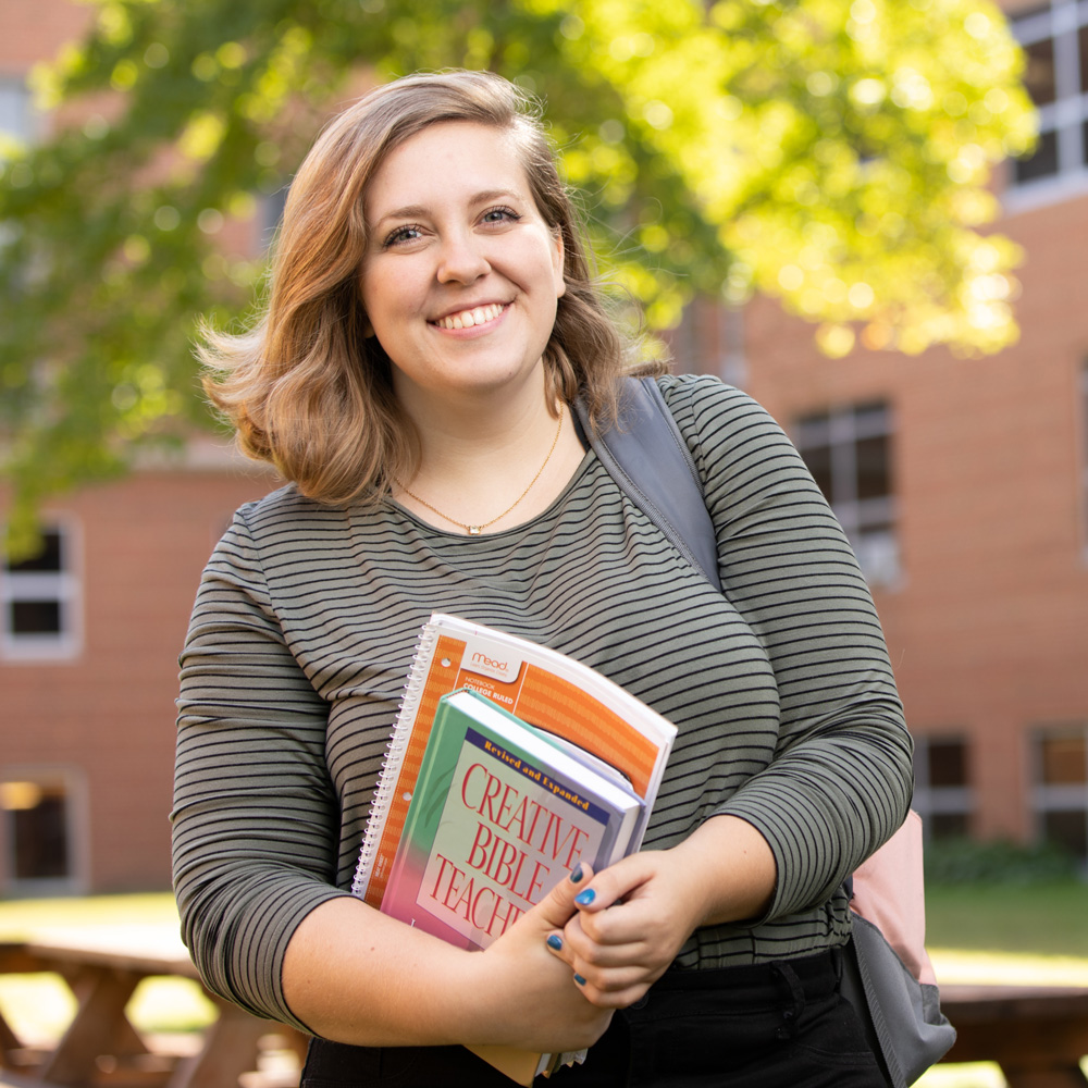 Student with Textbooks
