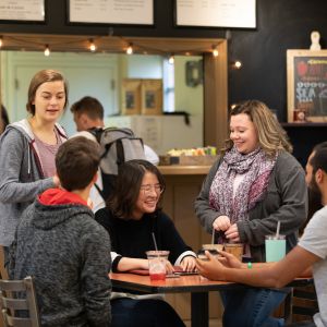 Emmaus students hanging out in campus coffee shop