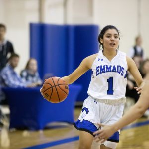 Female Dribbling Basketball in Emmaus Eagles Jersey
