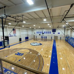 Gym floor featuring blue details and eagle logo