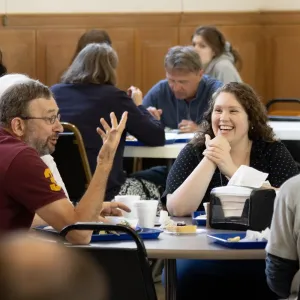 Conference attends enjoying a meal