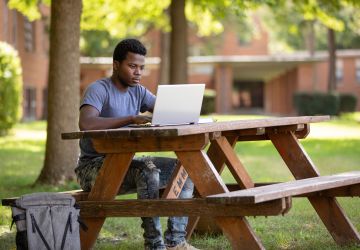 Emmaus student on laptop