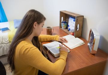 student studying in her room