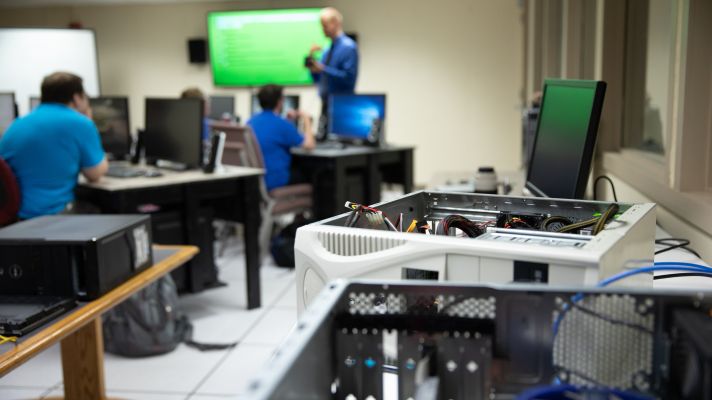 a computer lab work desk at Emmaus Bible College