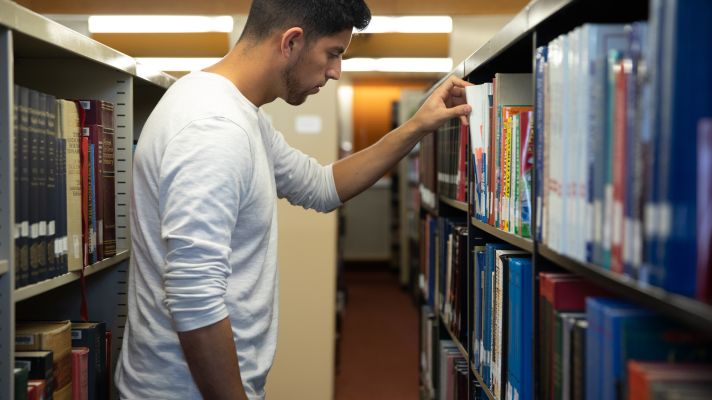 Emmaus student in the library