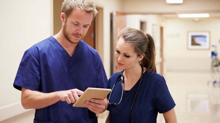 Healthcare workers consulting in a hospital